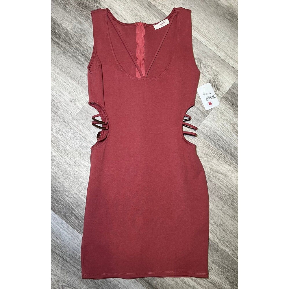 Bodycon mini dress with cutout metal sides‎ size small